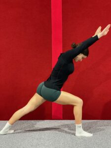 Gymnast in Perfect Lunge Position Preparing for a Cartwheel